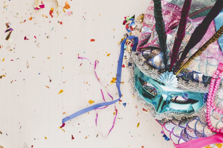 bright-costume-with-mask-in-confetti